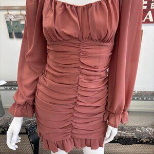 Elegant mint midi dress featuring a ruched body throughout, thin adjustable stra